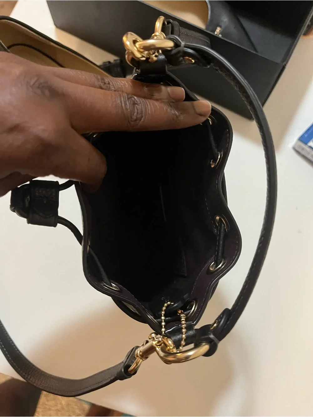 Coach Black Leather Pointed-Toe Pump with Gold Logo Accent. The purse is nwot